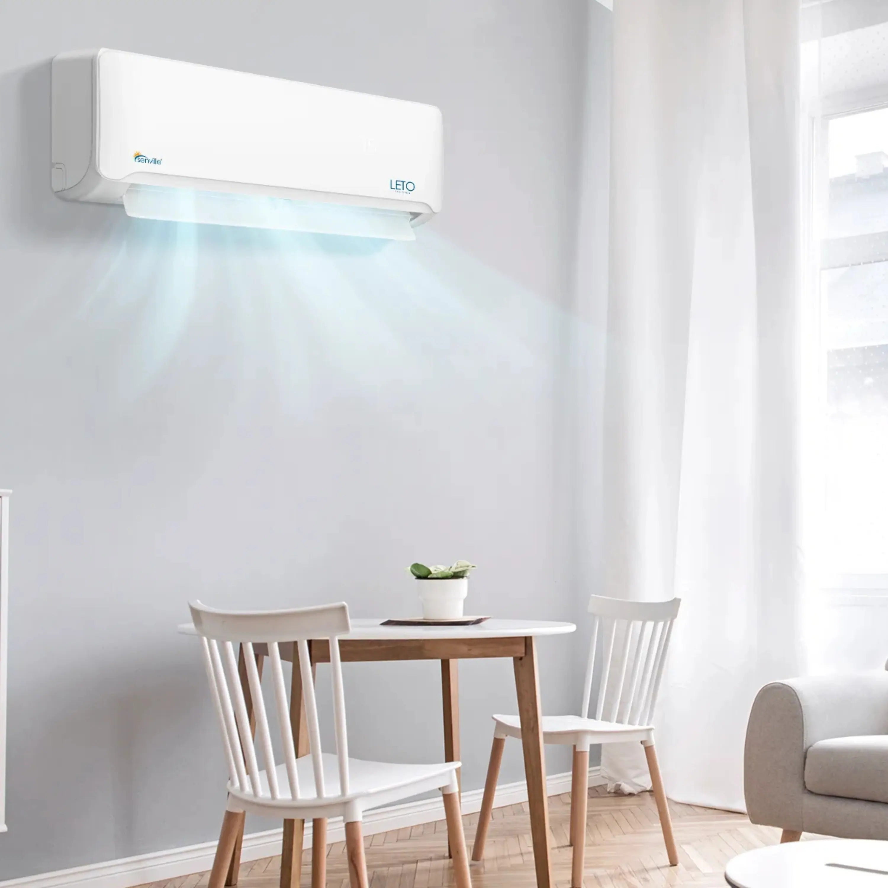 Wall-mounted mini split air conditioner, white unit blowing air with blue light