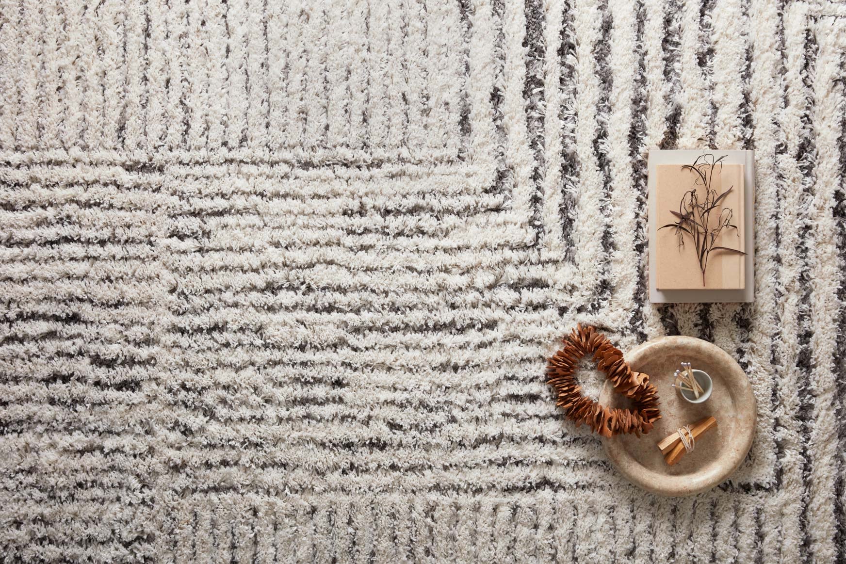 Ivory and grey shag runner rug close-up with wavy stripe texture