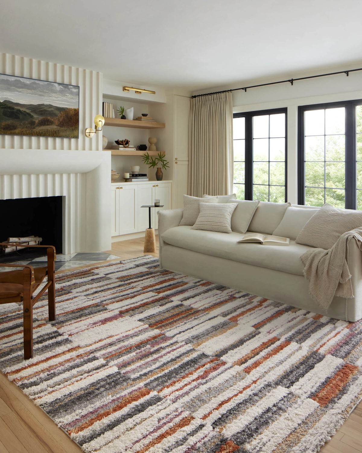 Multicolor striped shag area rug on wood floor