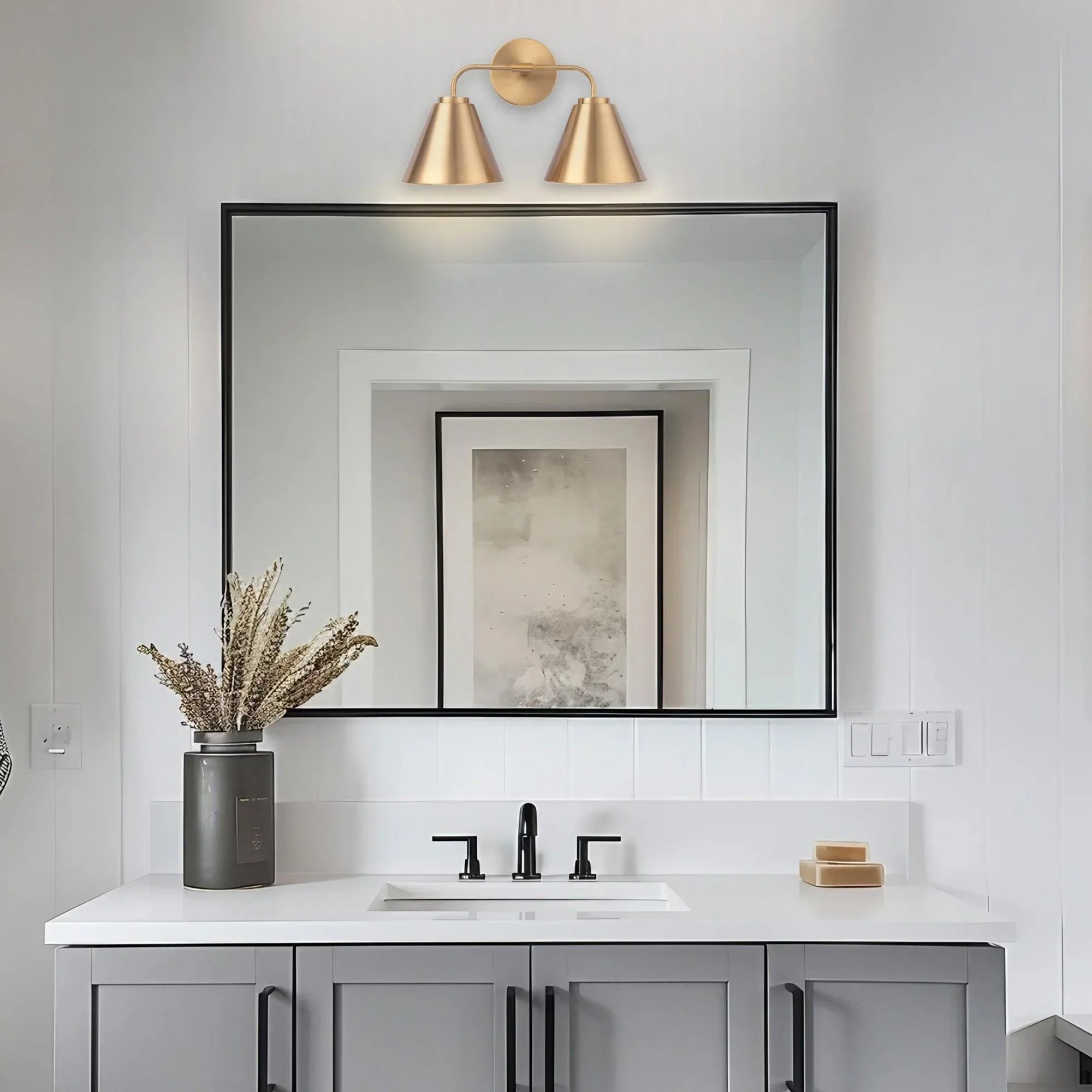 Golden 2-light vanity light with twin conical shades and round wall backplates