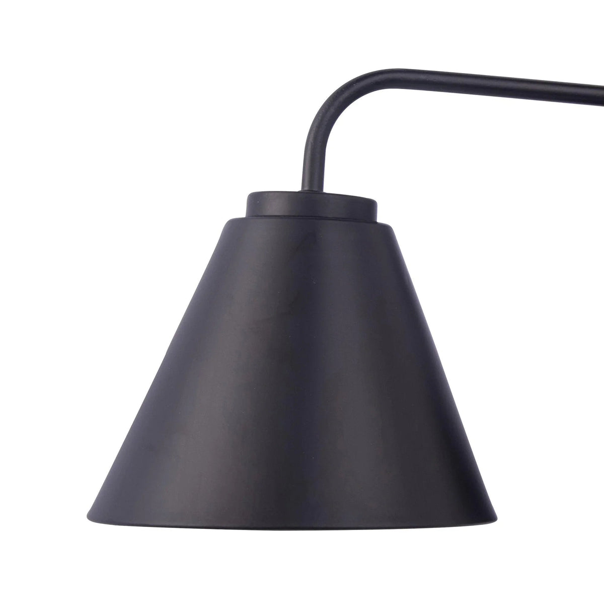 Black cone lamp shade on curved arm from 3-light vanity fixture, dark mounting