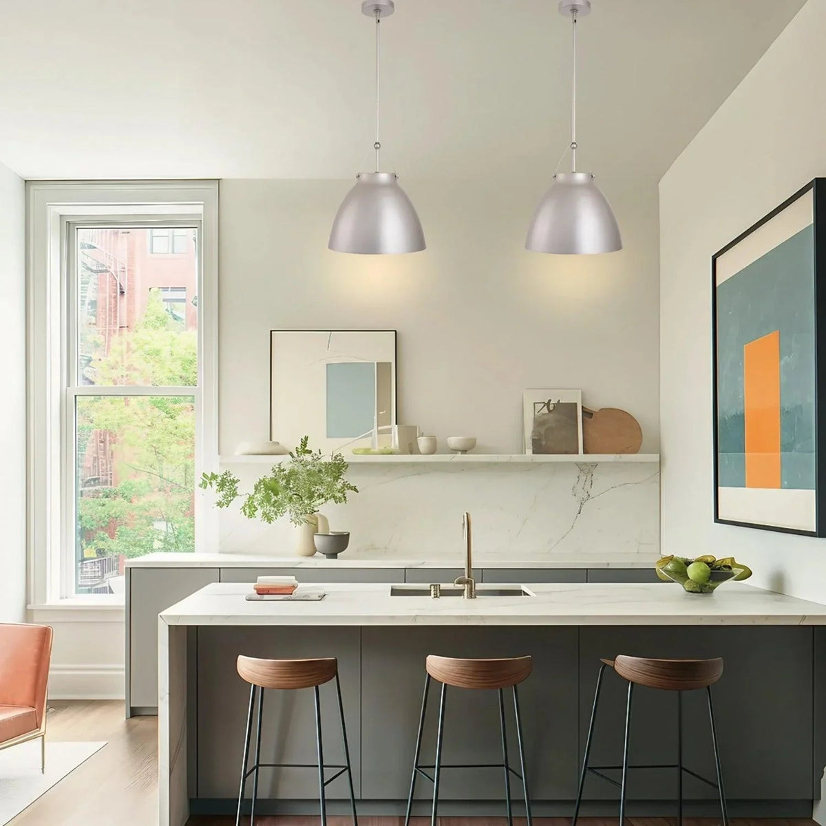 Brushed silver metal 1-light pendant light with tapered dome shade over island