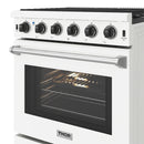 White gas range with six control knobs, oven window, and metal oven handle