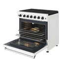 White gas range with oven door open, illuminated interior, and front glass oven window