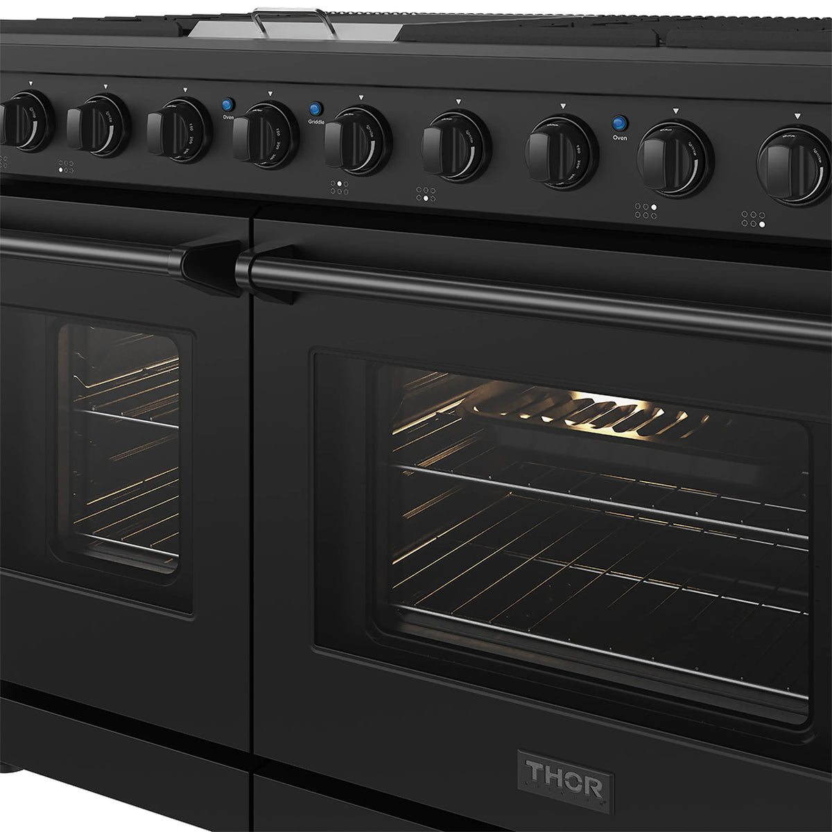 Black gas range oven window close-up showing racks and burner tray inside