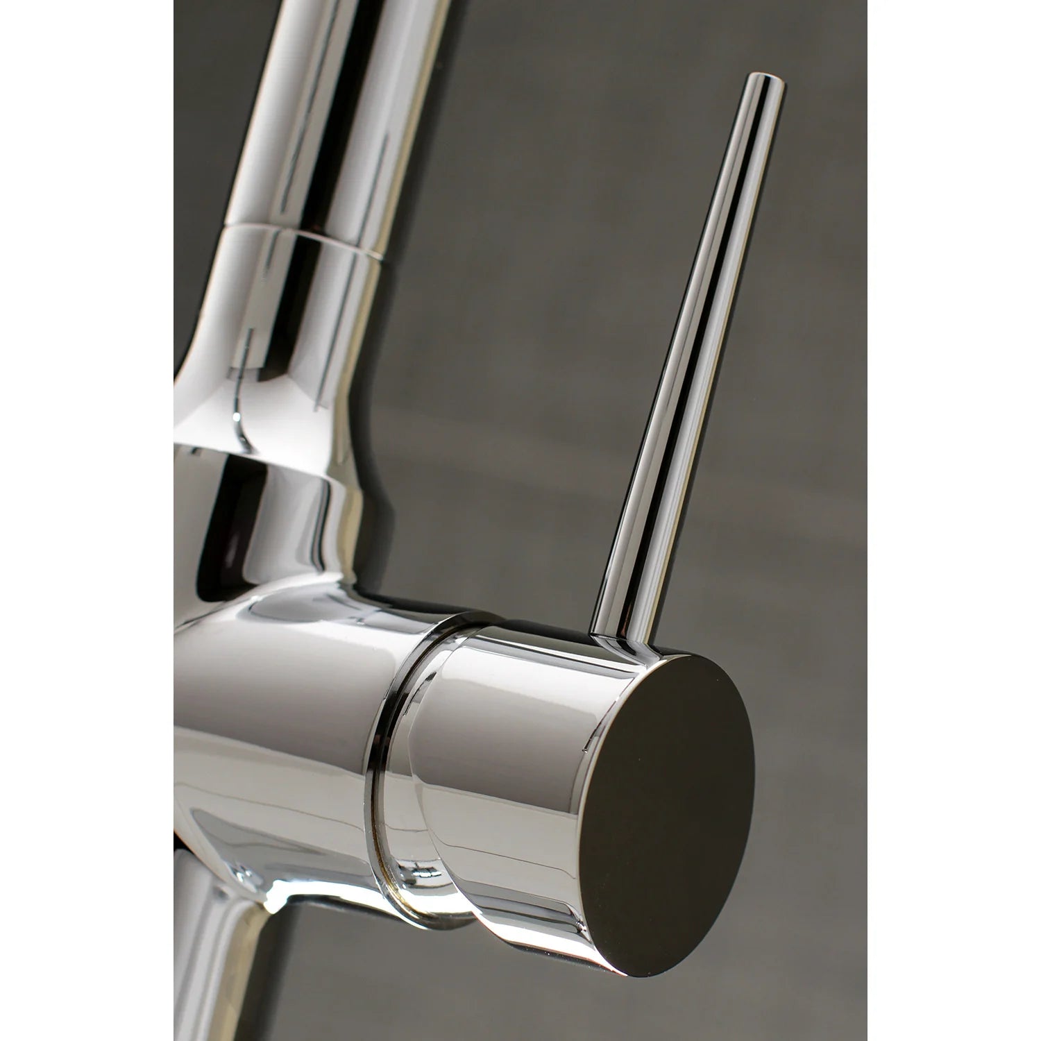 Polished chrome faucet handle and base with round control housing