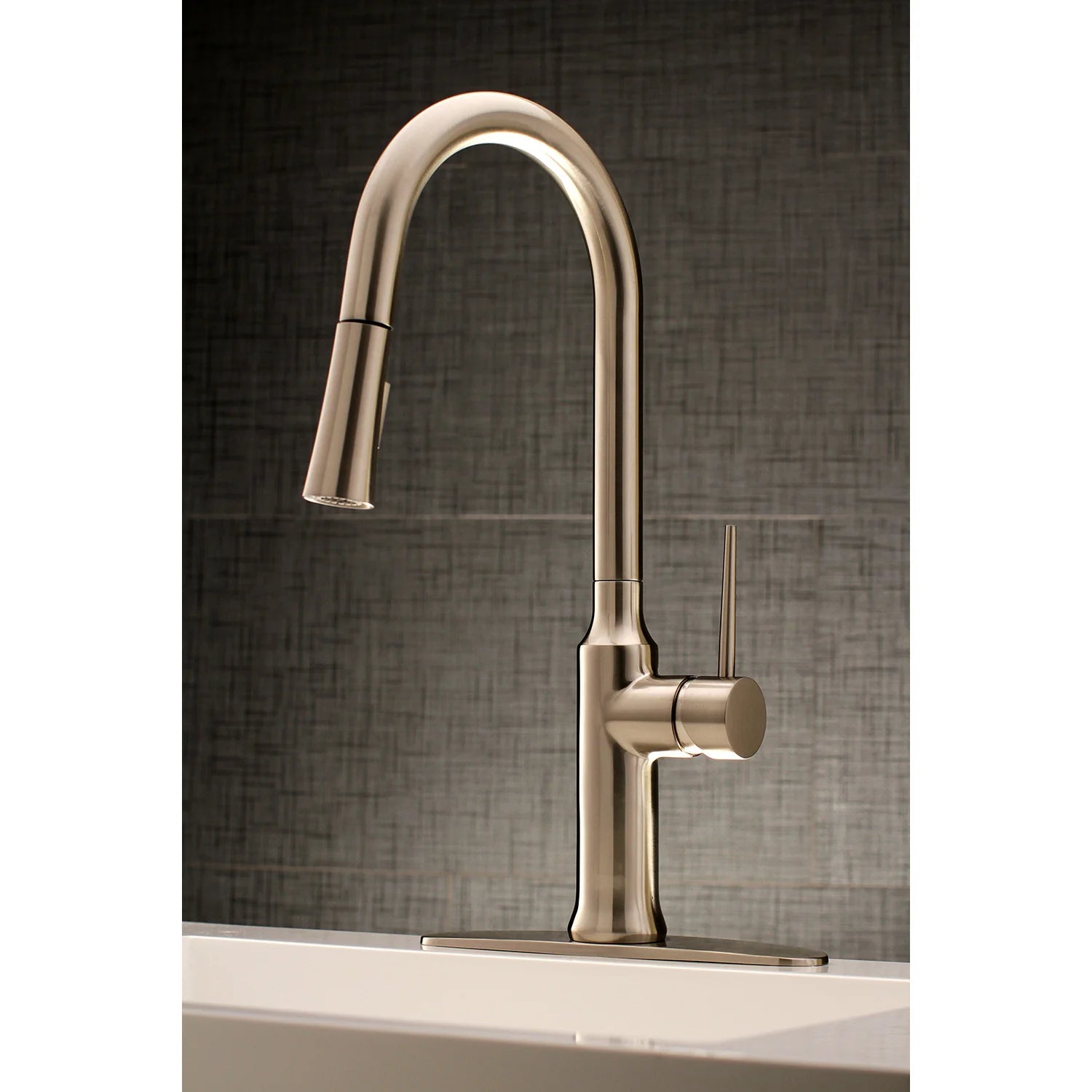Brushed nickel single-handle kitchen faucet with tall arched spout and pull-down hose