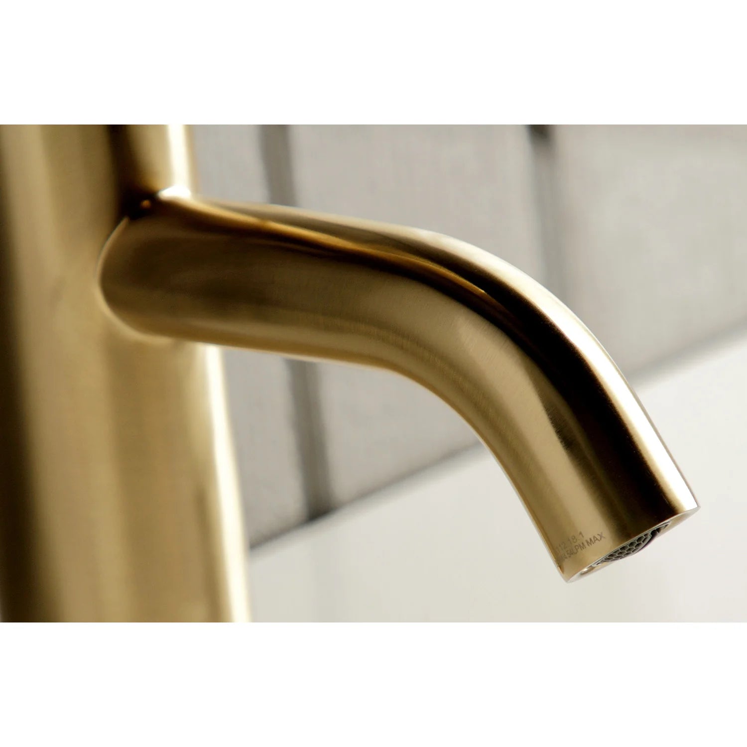 Brushed brass faucet spout underside and aerator outlet