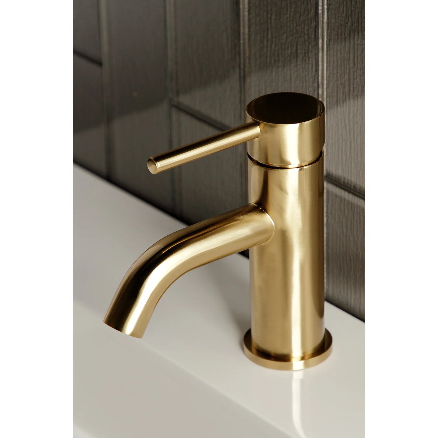 Brushed brass bathroom faucet with tall handle and arched spout