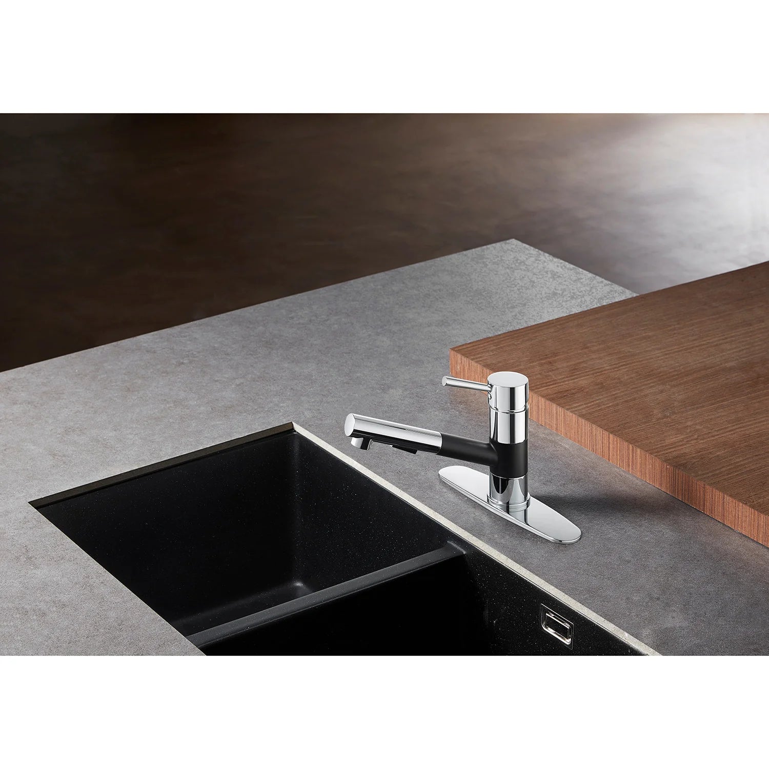 Single-handle kitchen faucet in matte black and chrome mounted over black sink