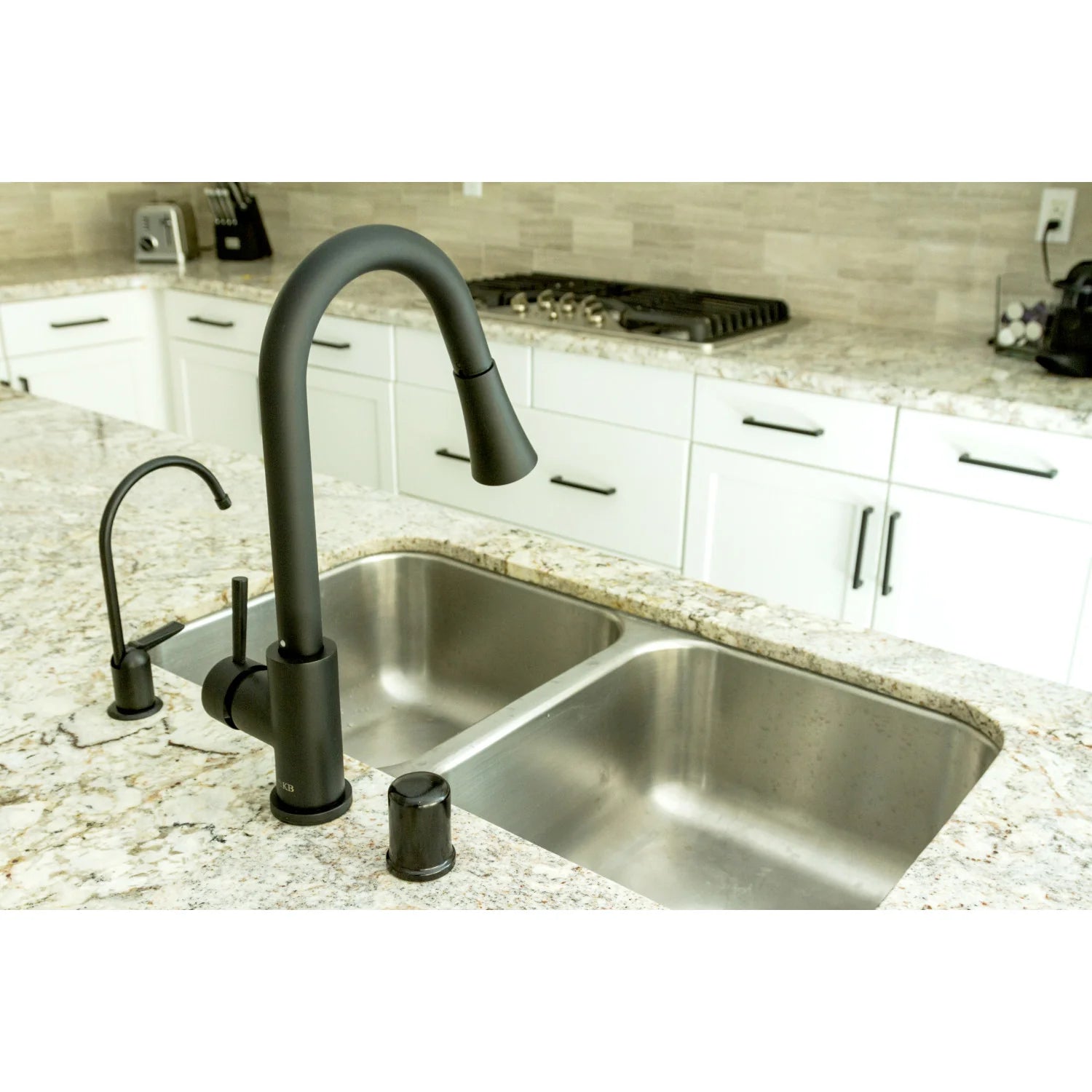 Matte black single-handle pull-down kitchen faucet mounted on countertop