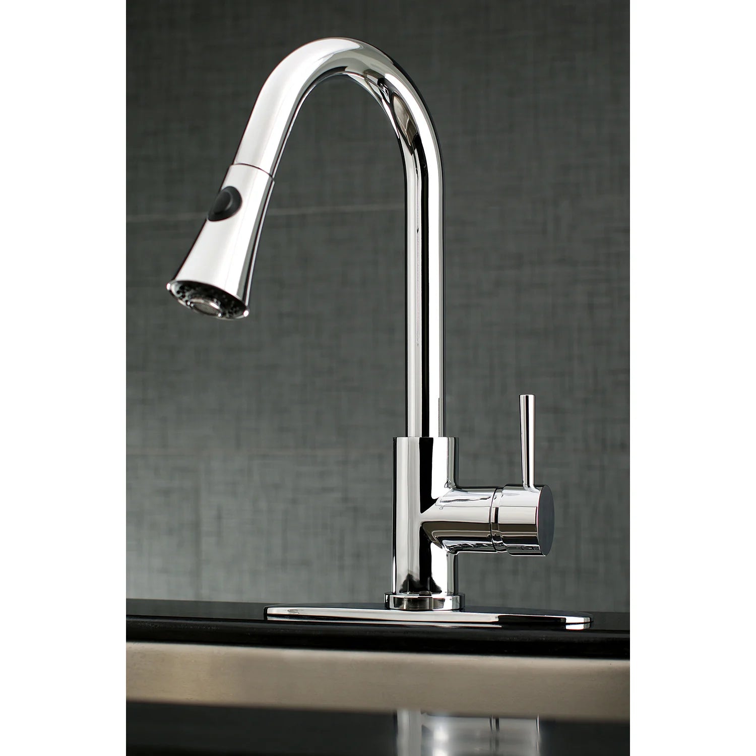 Polished chrome kitchen faucet with curved spout and side lever on deck