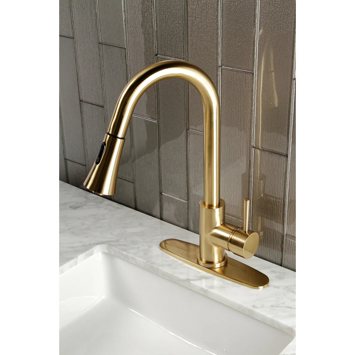 Brushed brass single-handle pull-down kitchen faucet with arched spout and deck base
