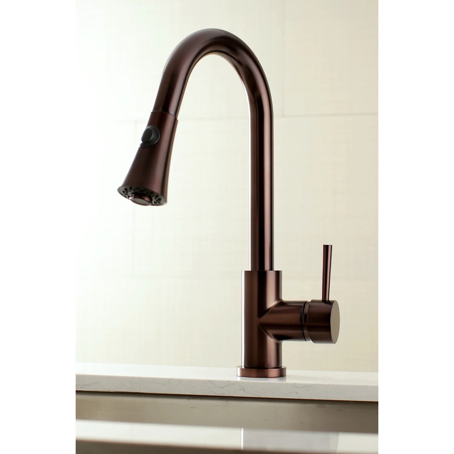 Oil rubbed bronze kitchen faucet with arched spout, pull-down spray head, and single lever