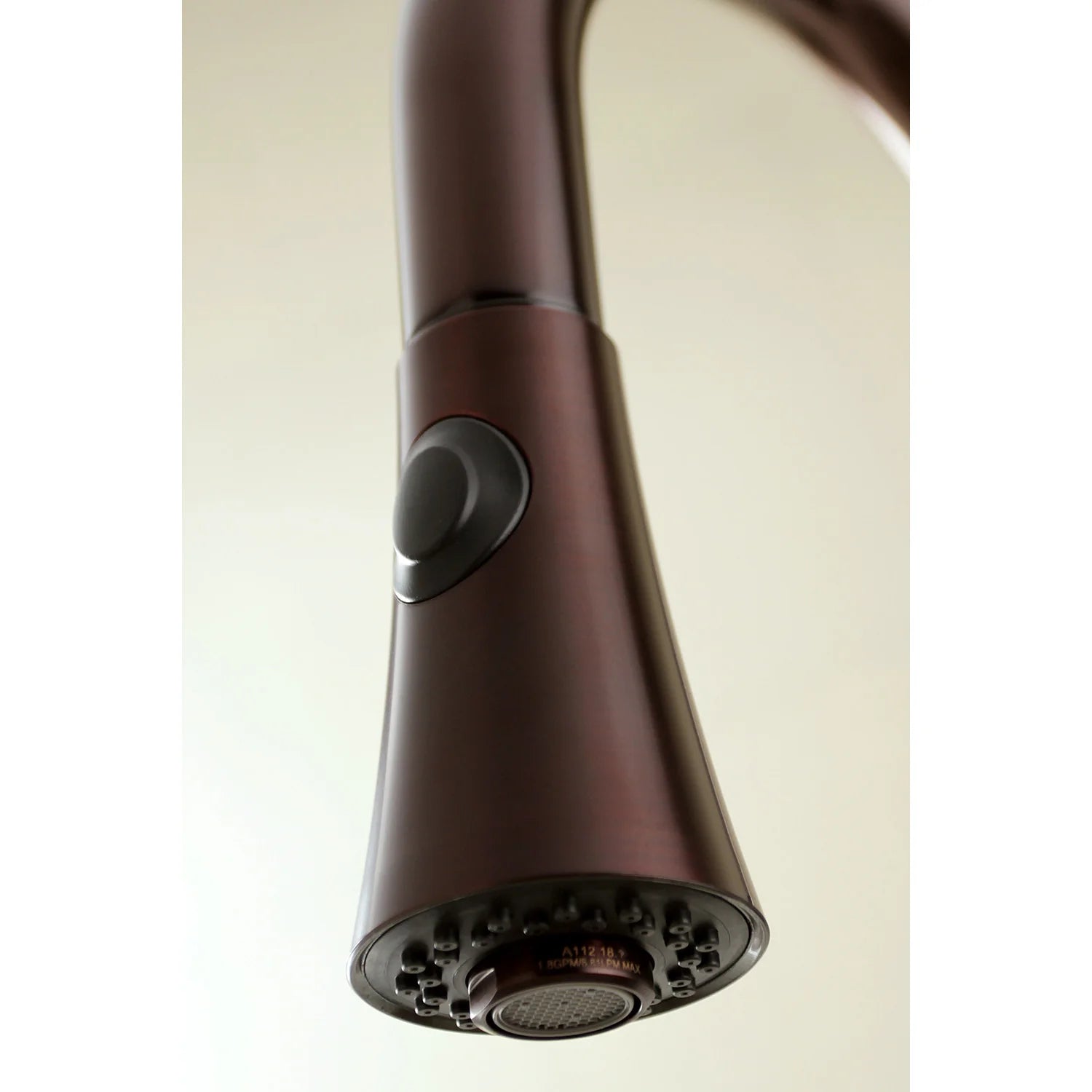 Oil rubbed bronze pull-down spray head with textured nozzles and side control button