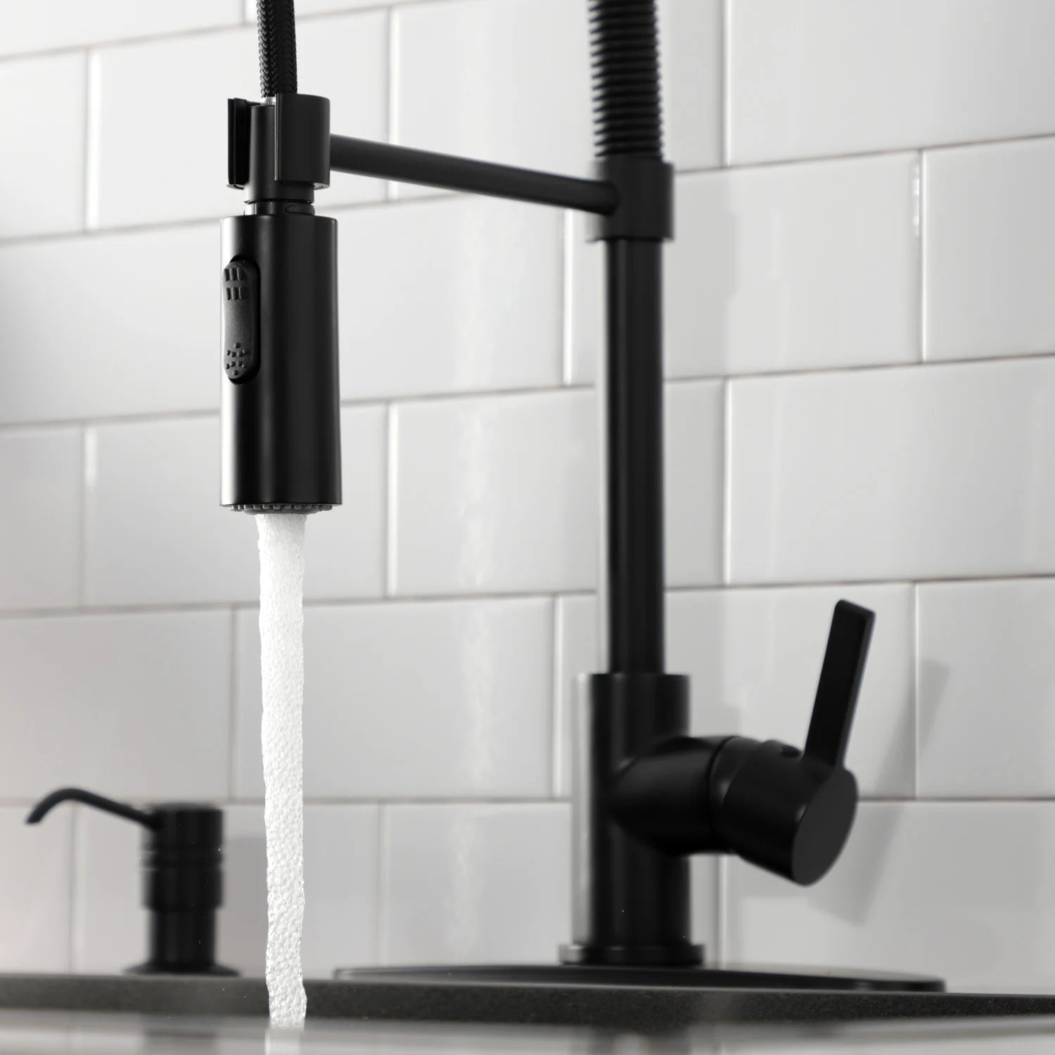 Matte black pre-rinse faucet with pull-down sprayer and side handle