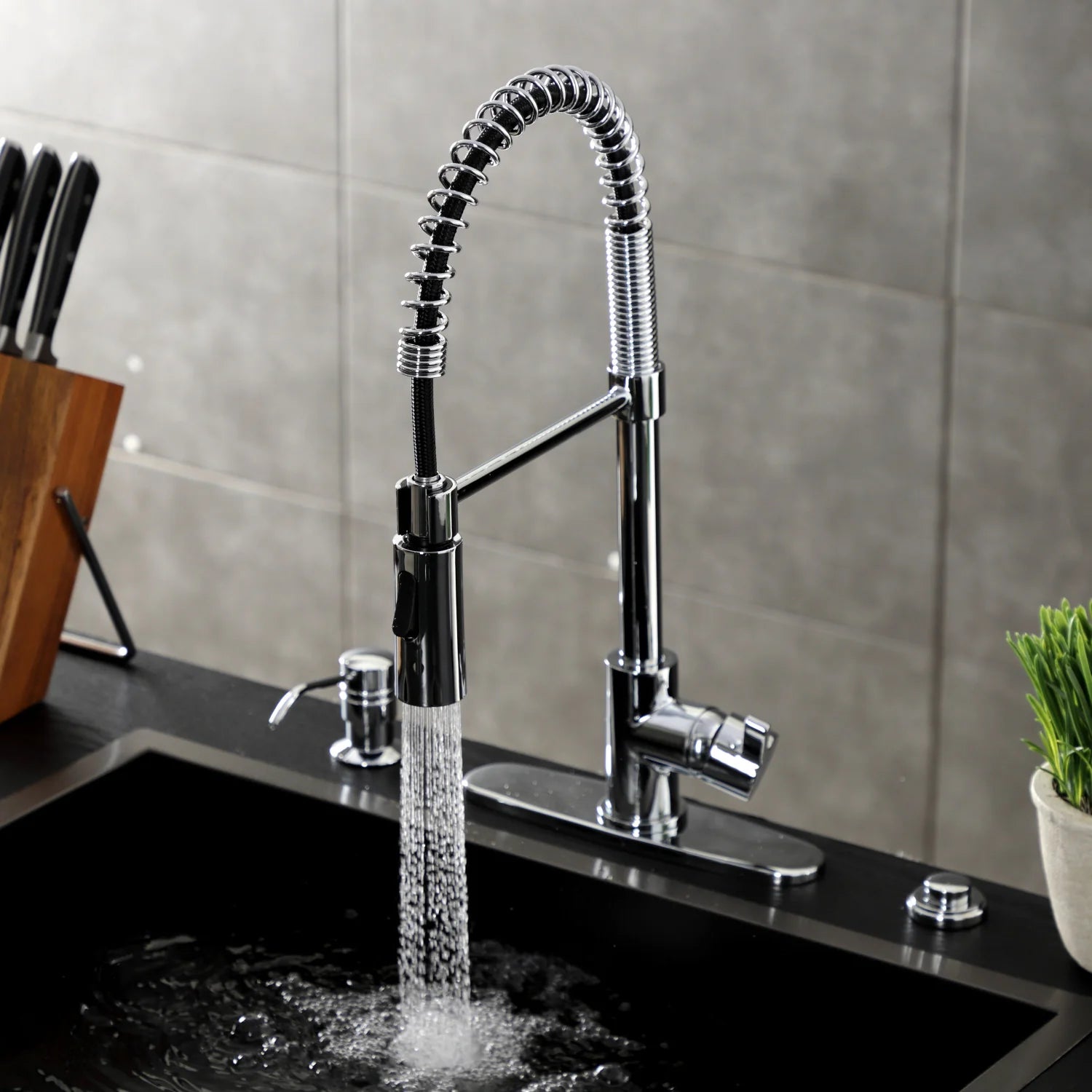 Polished chrome single-handle deck-mount faucet with arched spray hose and controls