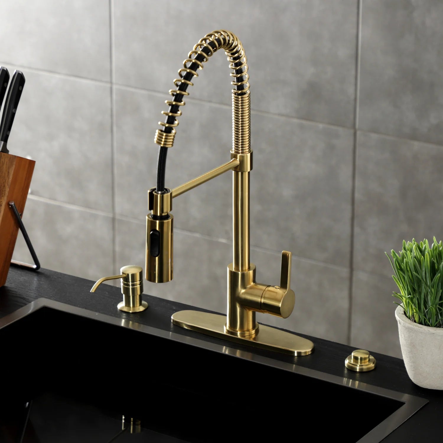 Brushed brass deck-mount kitchen pre-rinse faucet with coiled hose and side spray outlet