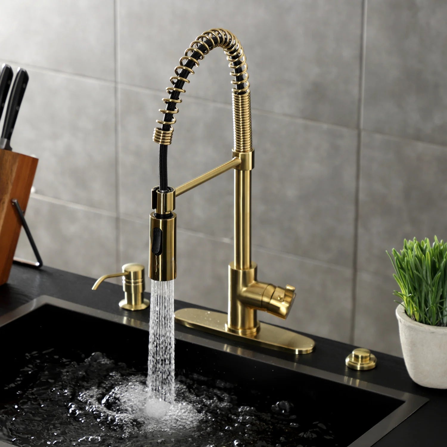 Brushed brass deck-mount pre-rinse faucet with coiled hose and spray stream