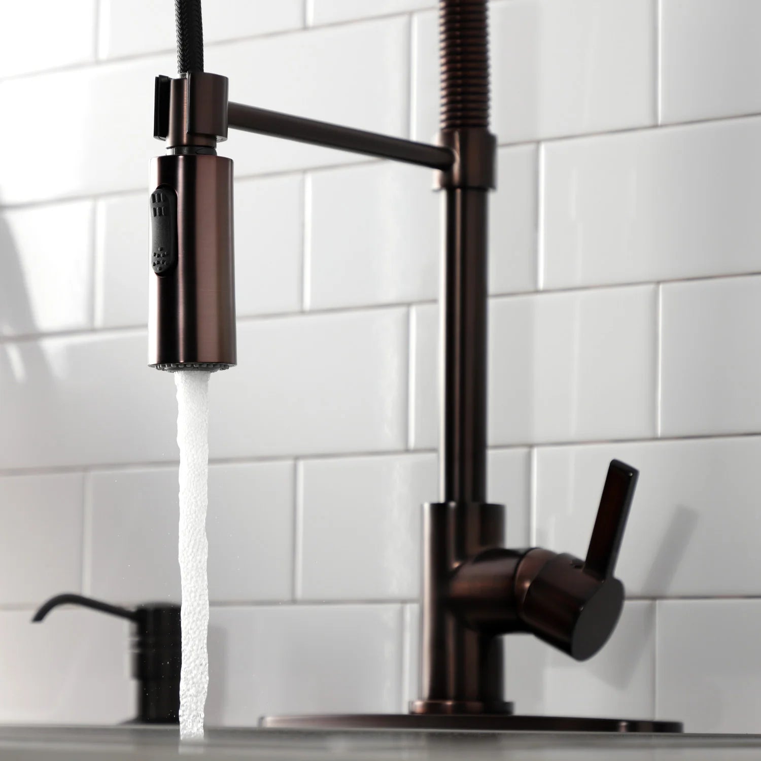 Oil-rubbed bronze kitchen faucet with single lever handle and pull-down spray head