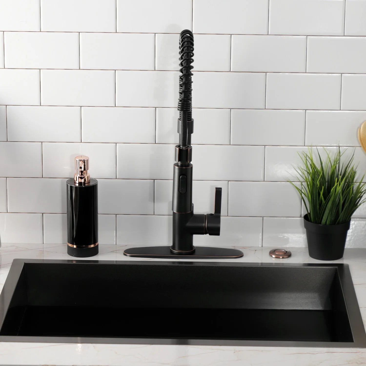 Deck-mount pull-down kitchen faucet with tall black spout and flexible coiled hose