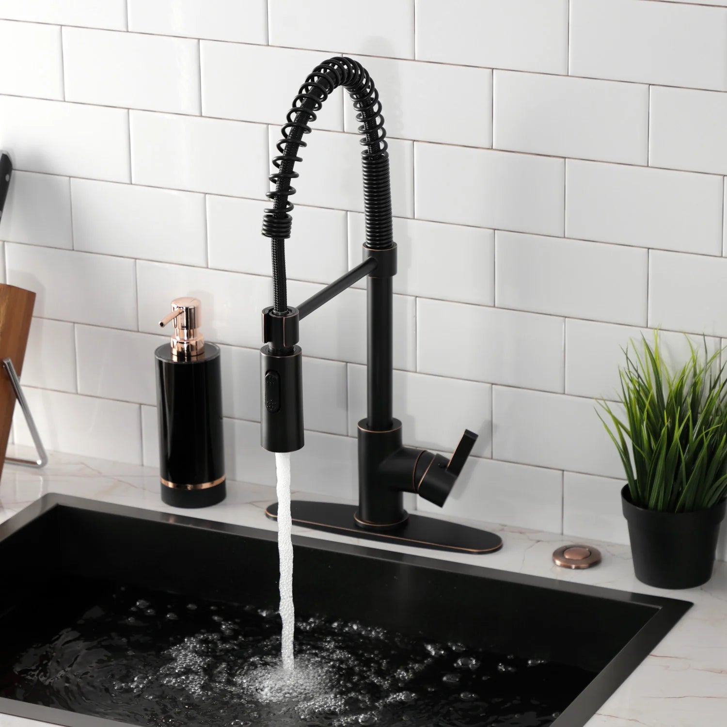 Pull-down kitchen faucet with single lever handle and flowing water stream