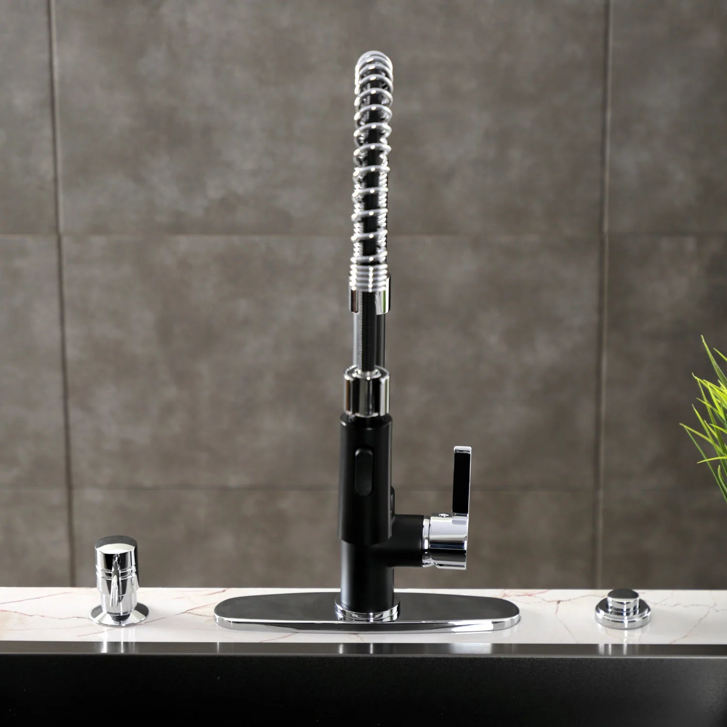Matte black deck-mount pre-rinse faucet with polished chrome hose and circular base plate