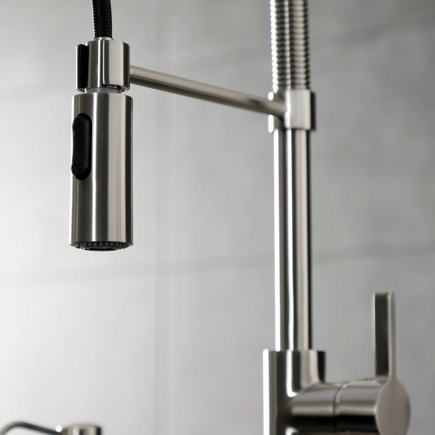 Brushed nickel single-handle pre-rinse faucet with arched spout and pull hose