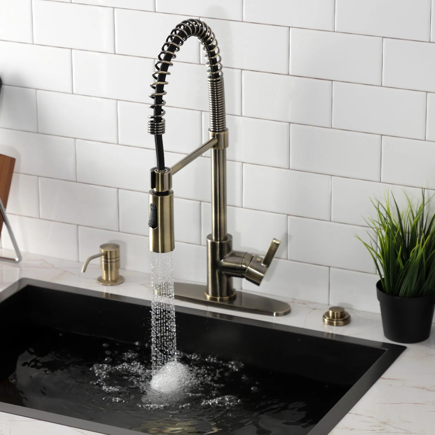 Antique brass deck-mount pre-rinse faucet with steady spray stream and arched hose
