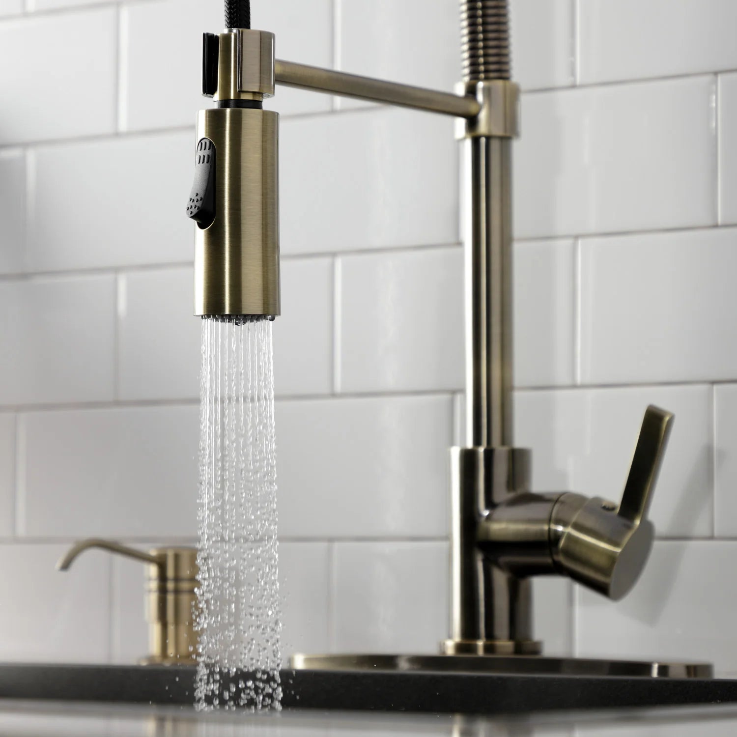 Antique brass pre-rinse faucet with pull-down spray stream and single control handle