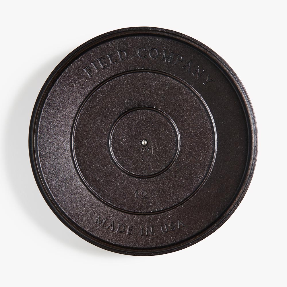 Cast iron lid underside with embossed Field Company logo and Made in USA