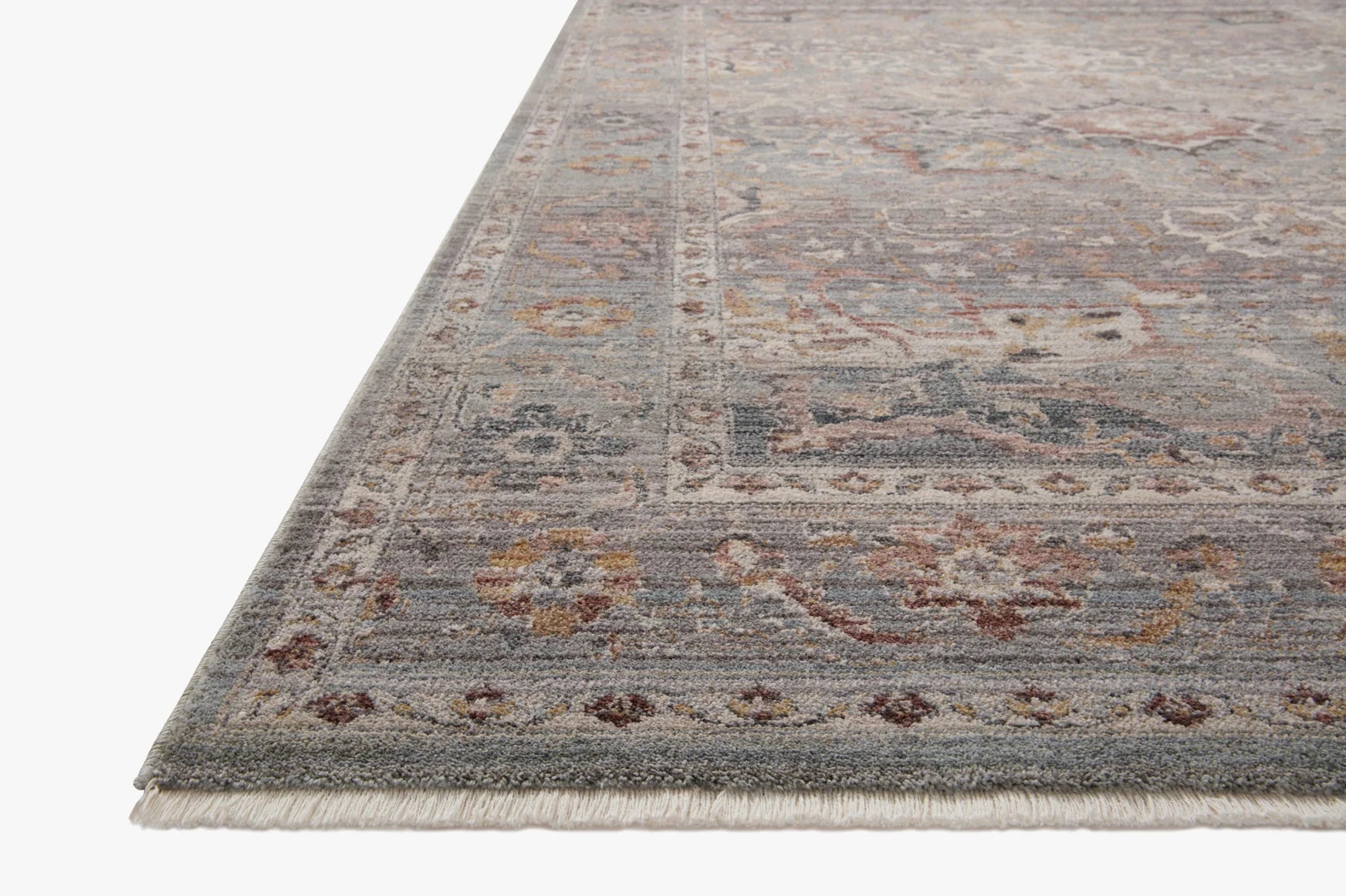Sky blue and gray vintage-style accent rug with ornate medallion pattern and fringe edge