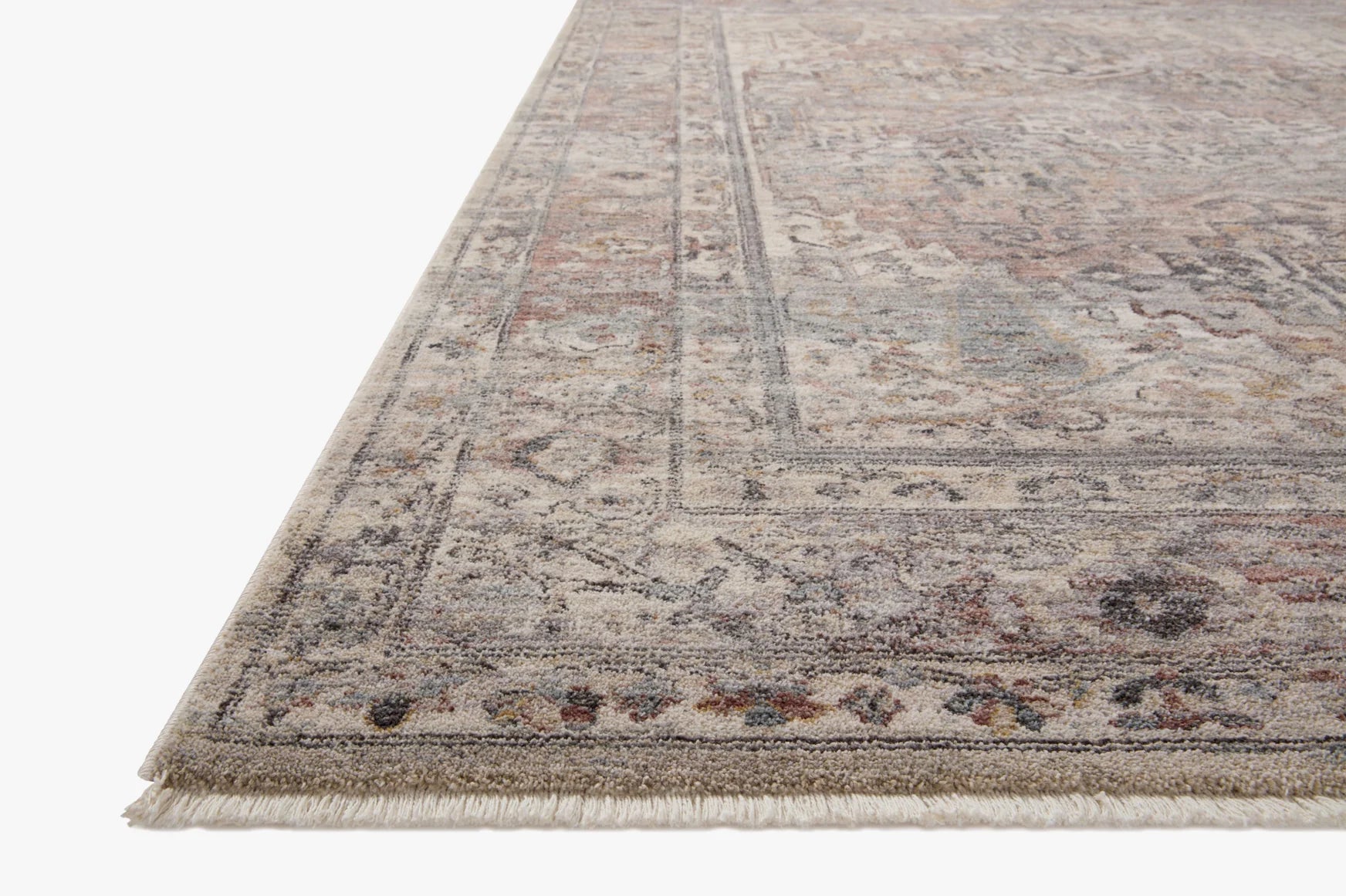 Persian-style area rug with faded medallion pattern and fringe edge, gray and taupe