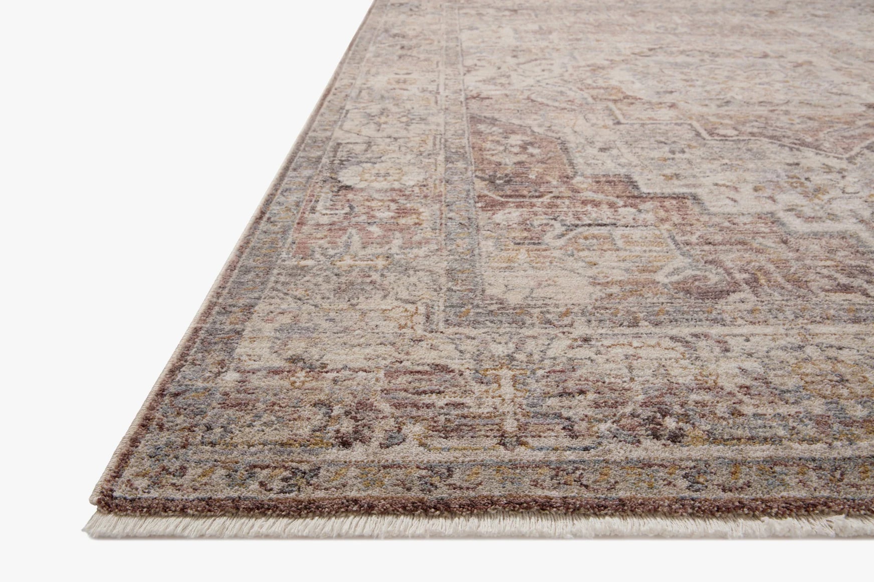 Berry and stone area rug with distressed medallion pattern and short fringed border