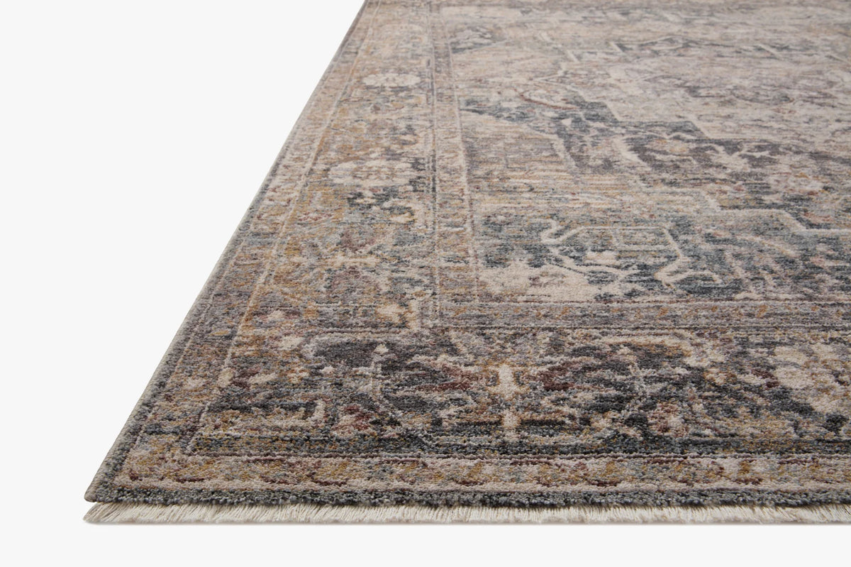 Round area rug with vintage medallion pattern, distressed denim and sand tones