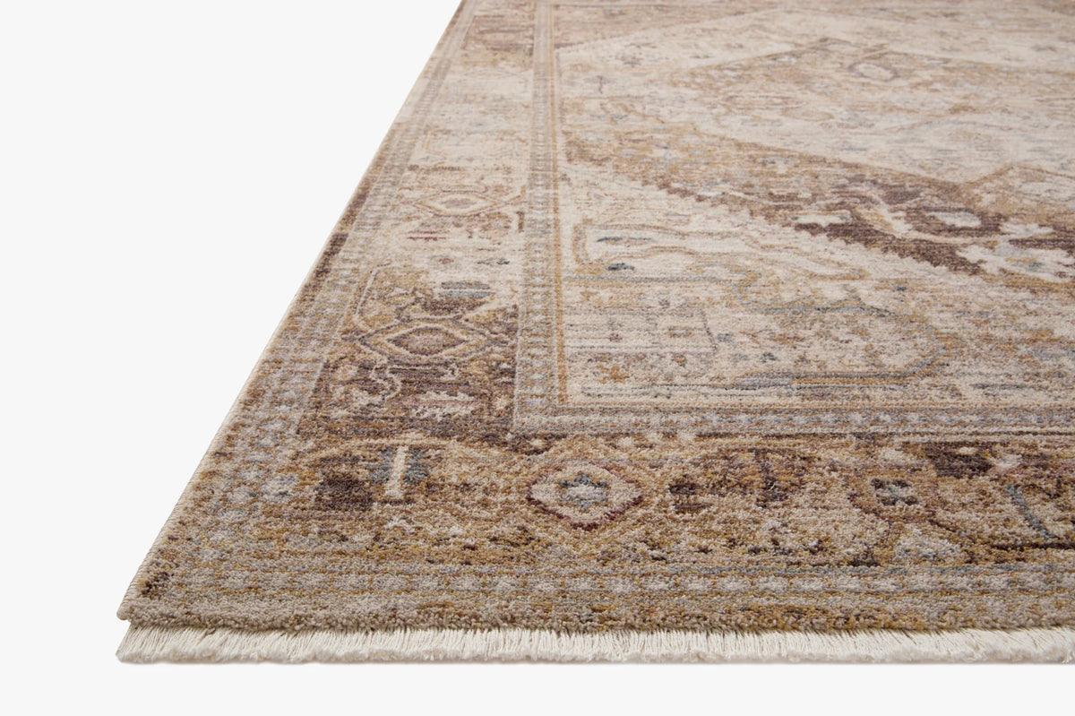 Natural and mocha area rug with distressed medallion border and short fringe edges