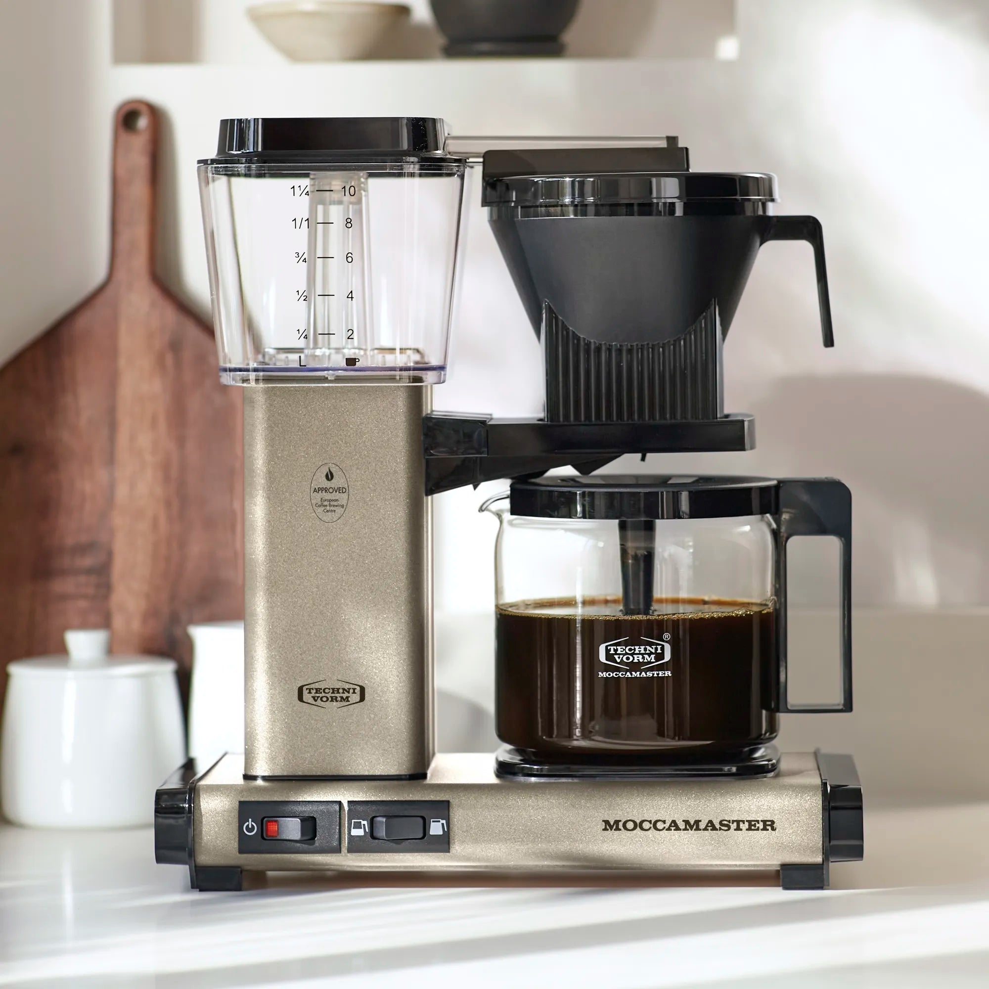 Sandstone 10-cup drip coffee maker with glass carafe and black filter funnel