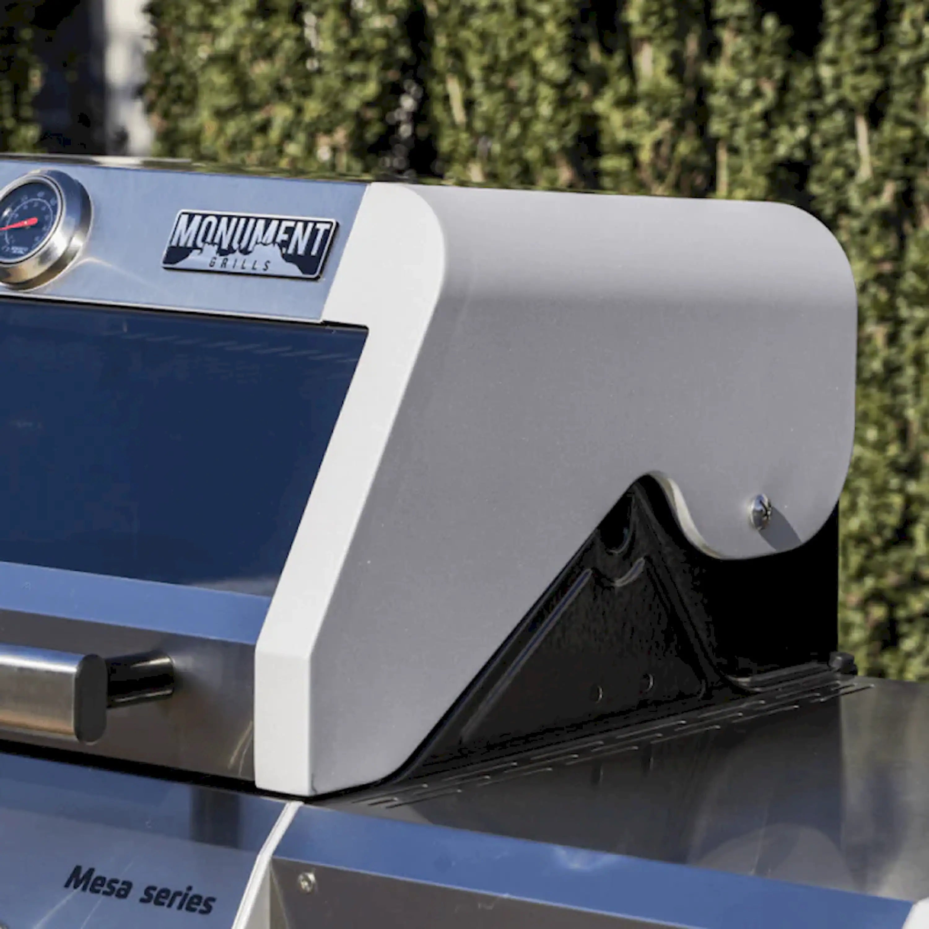 Stainless steel propane grill control panel and side of open lid