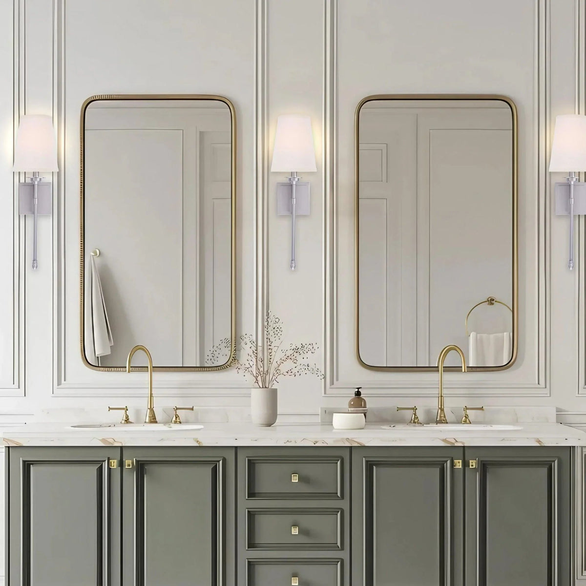 Black 1-light wall sconce with white fabric shade mounted on wall near sink