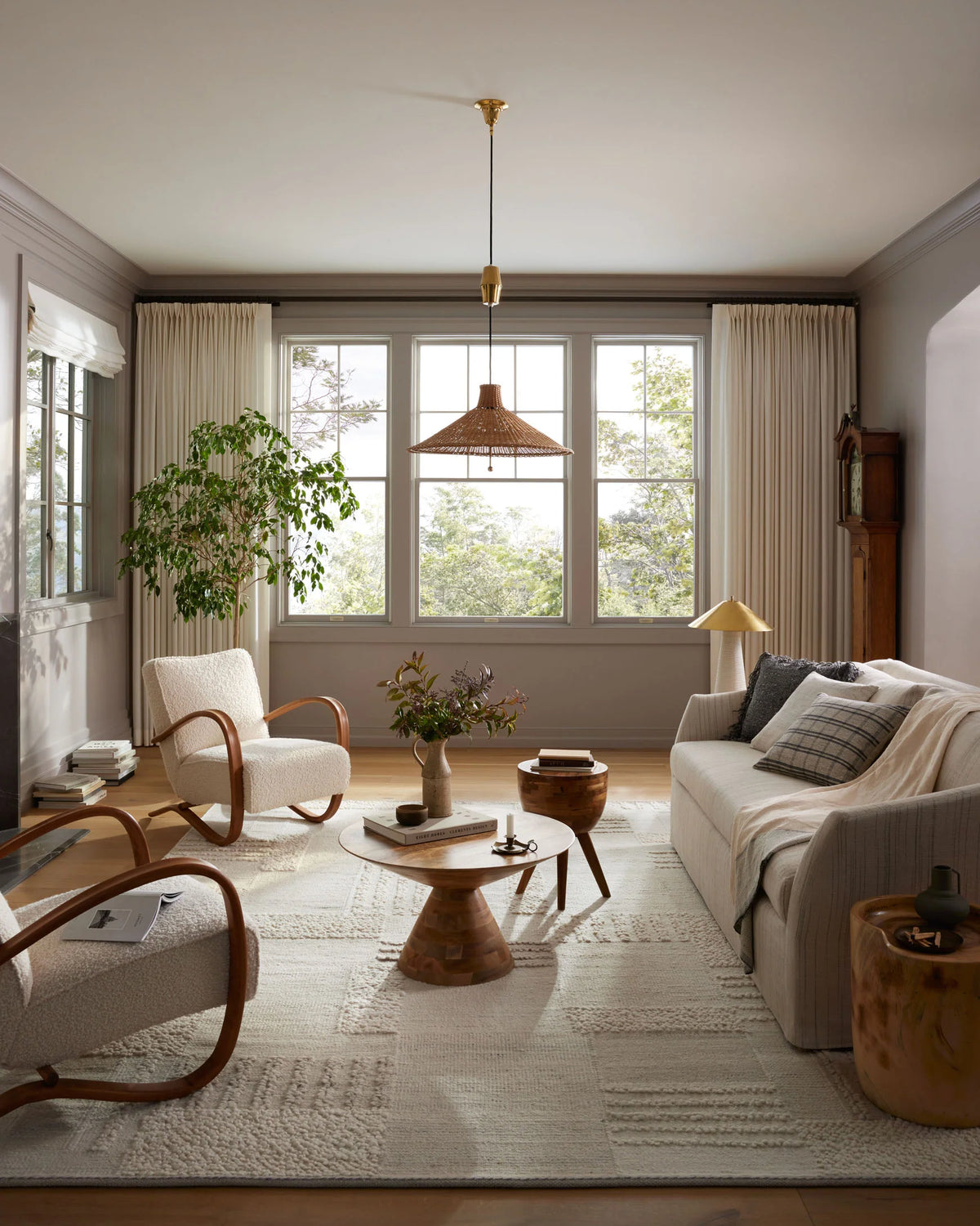 Ivory and pebble textured area rug with abstract geometric panel pattern