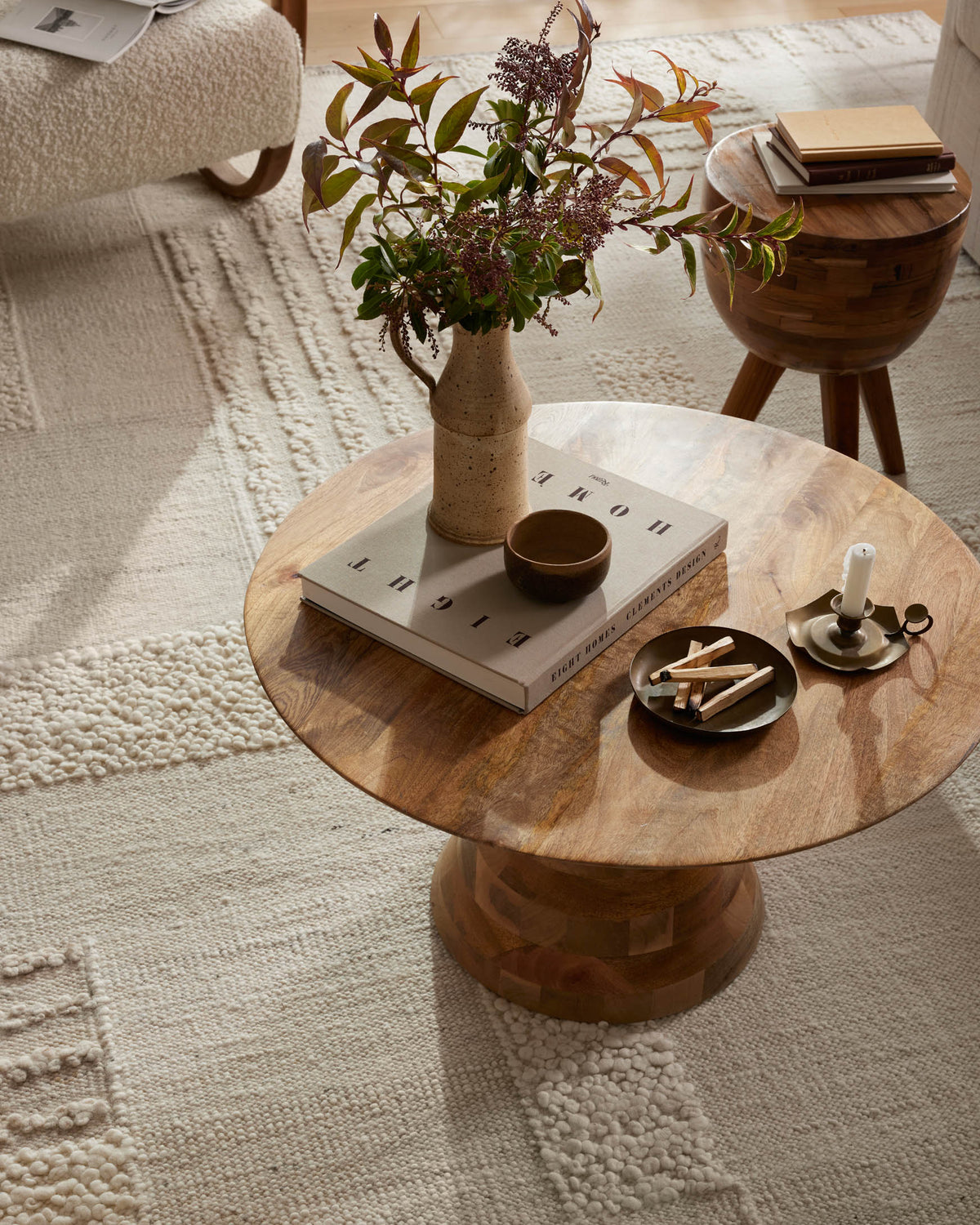 Ivory textured area rug with dense loop pile and patchwork pattern blocks