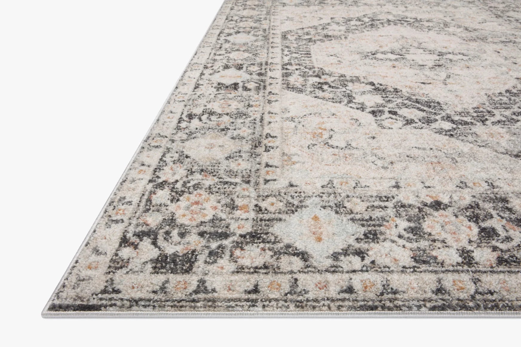 Charcoal and light gray distressed geometric area rug with border edge