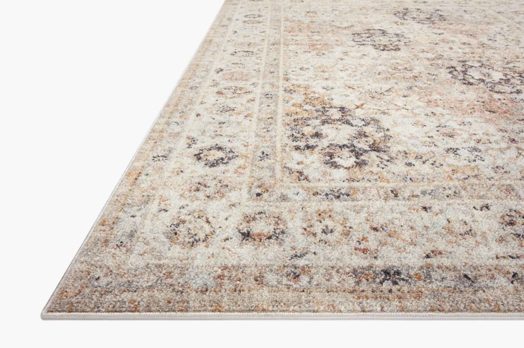Beige area rug with distressed medallion pattern and narrow border on edges