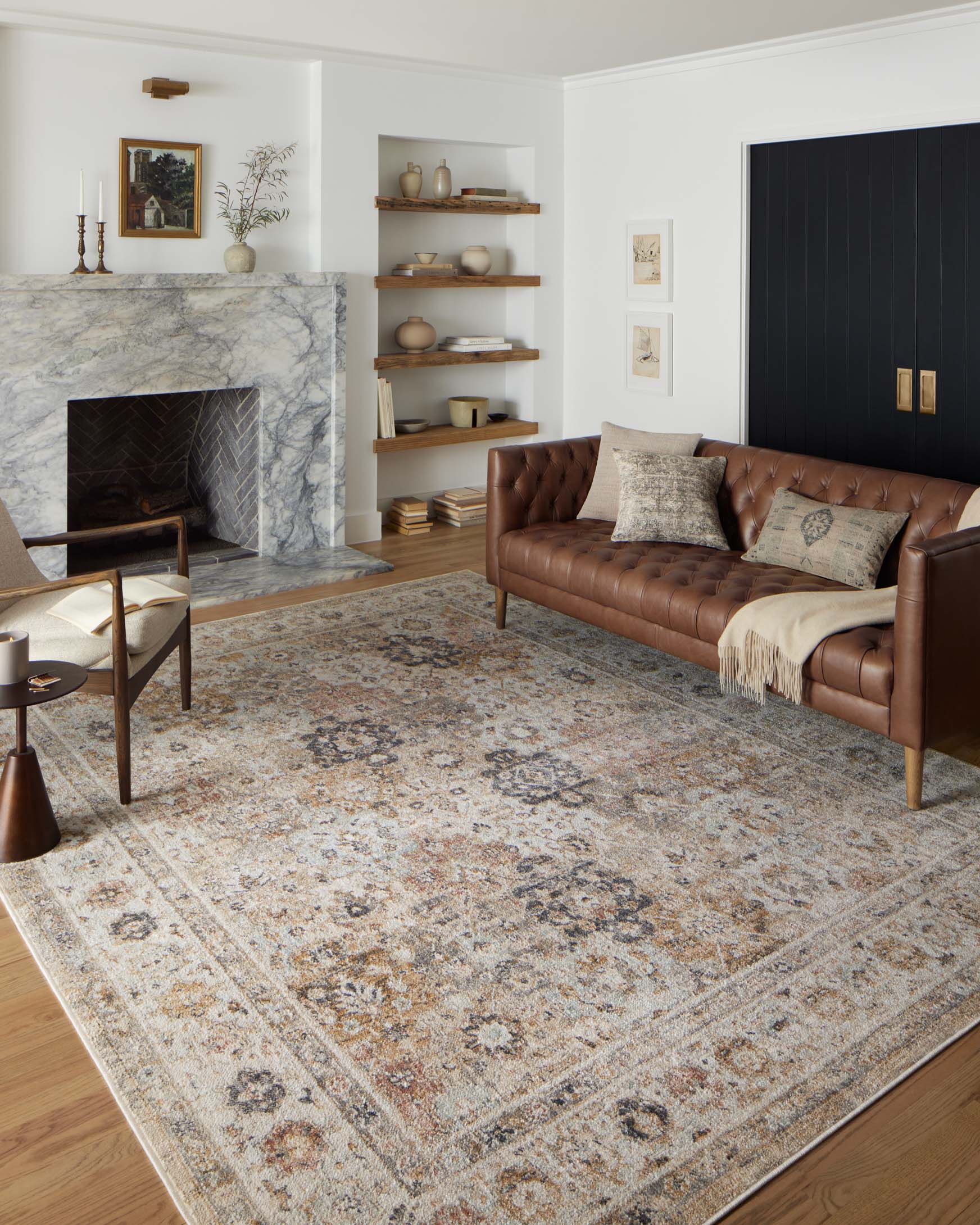 Beige area rug with distressed abstract pattern and subtle border detail