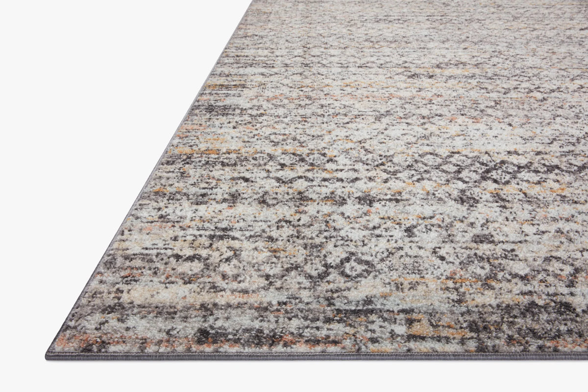 Gray rectangular area rug with abstract speckled pattern, 7'10" x 10'