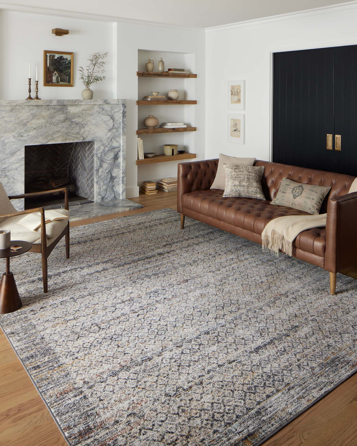 Gray abstract area rug with mottled texture and dark border