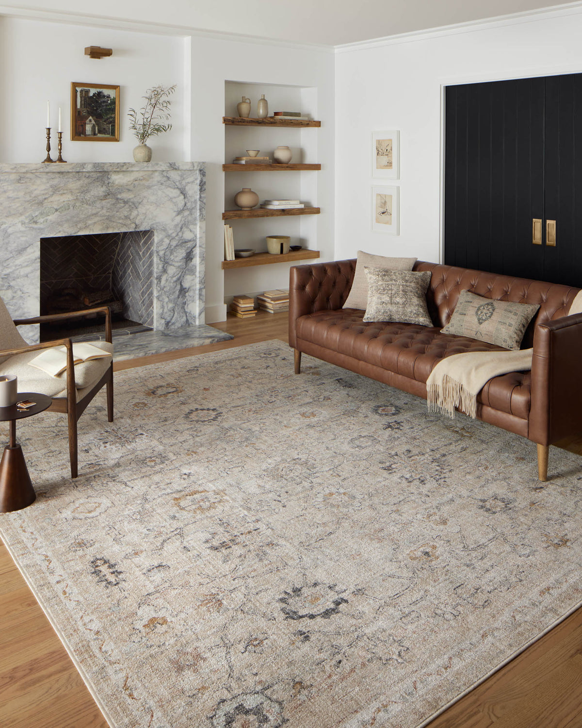 Natural accent rug with faded distressed motif pattern, shown laid in a room setting