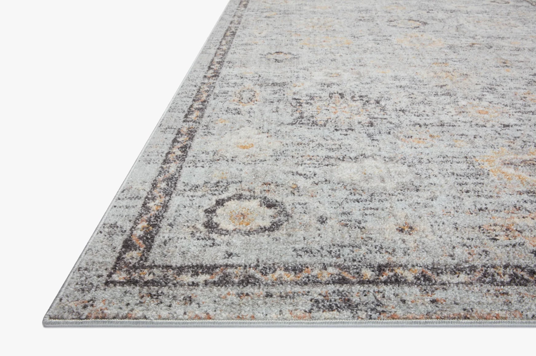 Rectangular area rug with distressed light gray pile and dark border, scattered gold accents