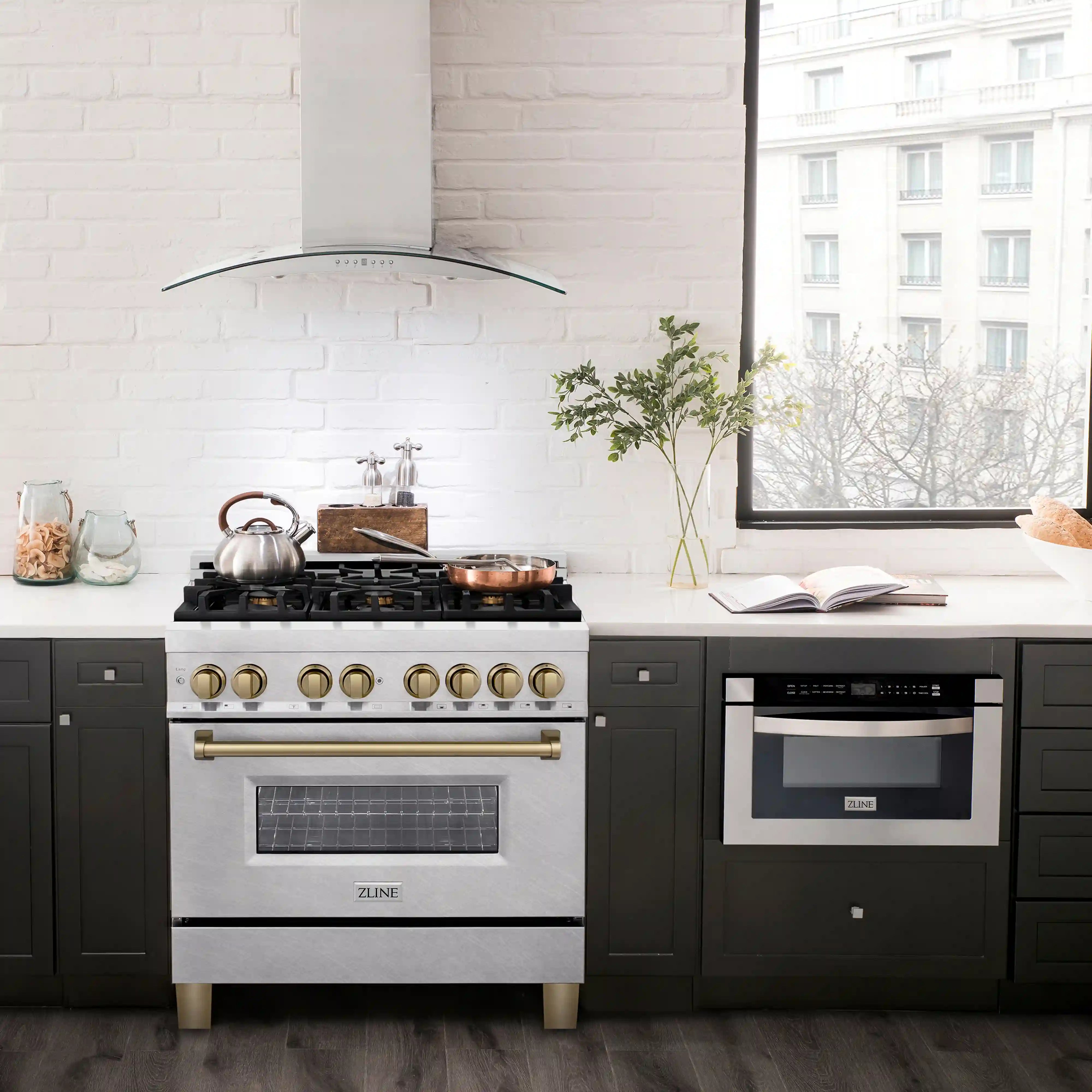36-inch dual fuel range with stainless steel finish and champagne bronze control accents