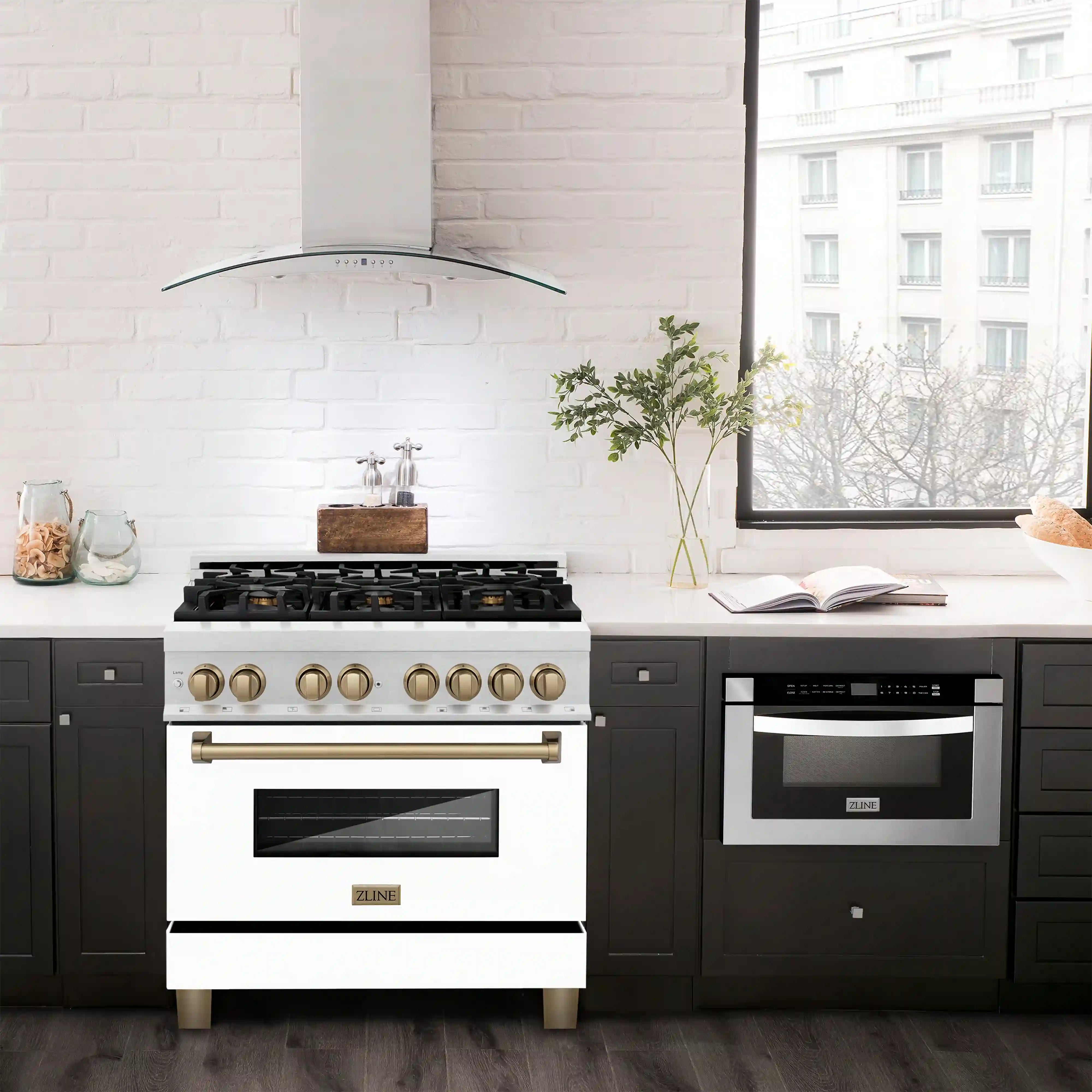 Dual fuel range in white with gold knobs and handle, black oven door and cooktop